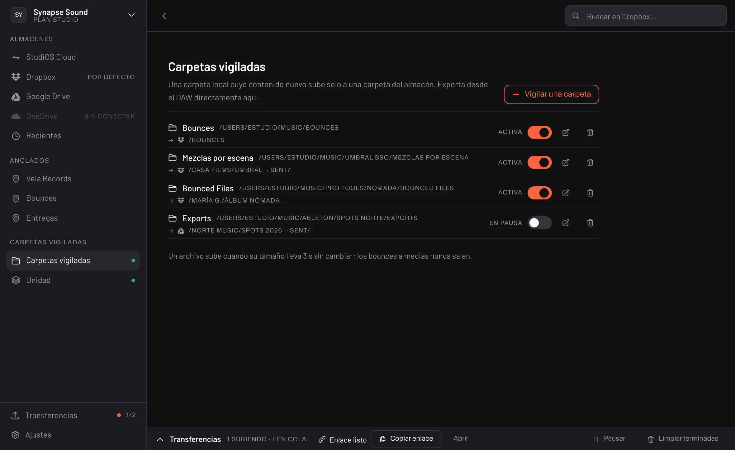 Uploader — cuatro carpetas vigiladas, tres activas y una en pausa